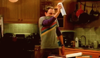 Jim Parsons as Sheldon Cooper indiscriminately spraying disinfectant in the air